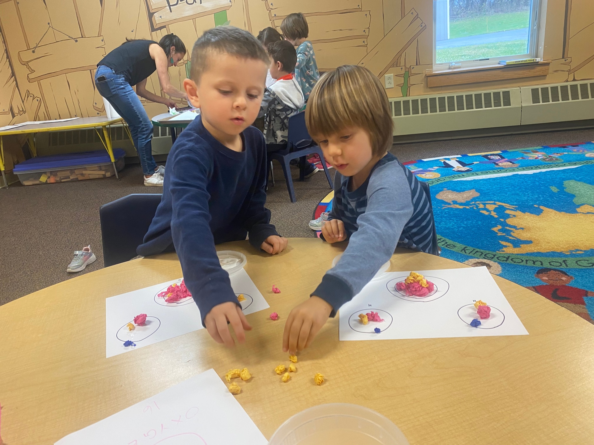 Young learners working on a hands-on craft project